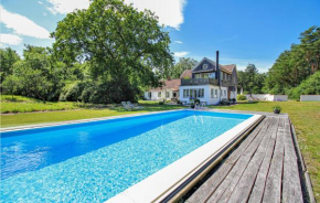 Amazing home in Borrby with Outdoor swimming pool, WiFi and Heated swimming pool